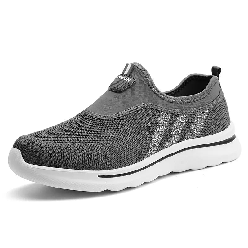 Gray slip-on sneaker with white sole on a white background