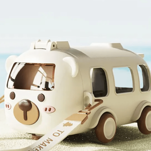 Toy car with a bear face design on a beach