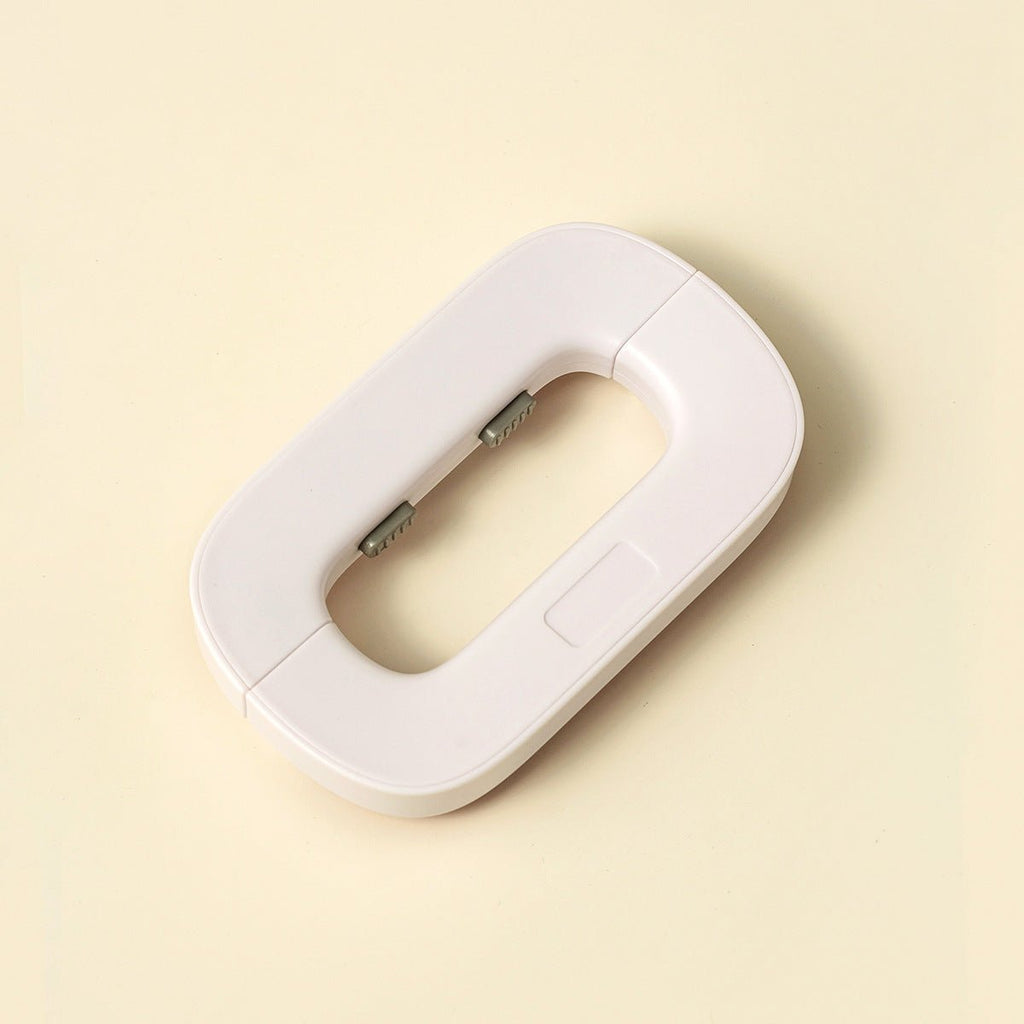 White electronic device on a beige background