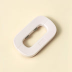 White electronic device on a beige background