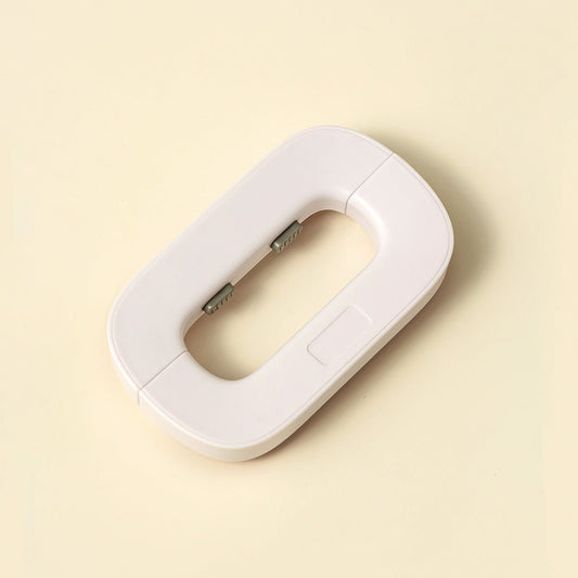 White electronic device on a beige background