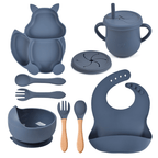Collection of blue baby utensils and accessories on a white background