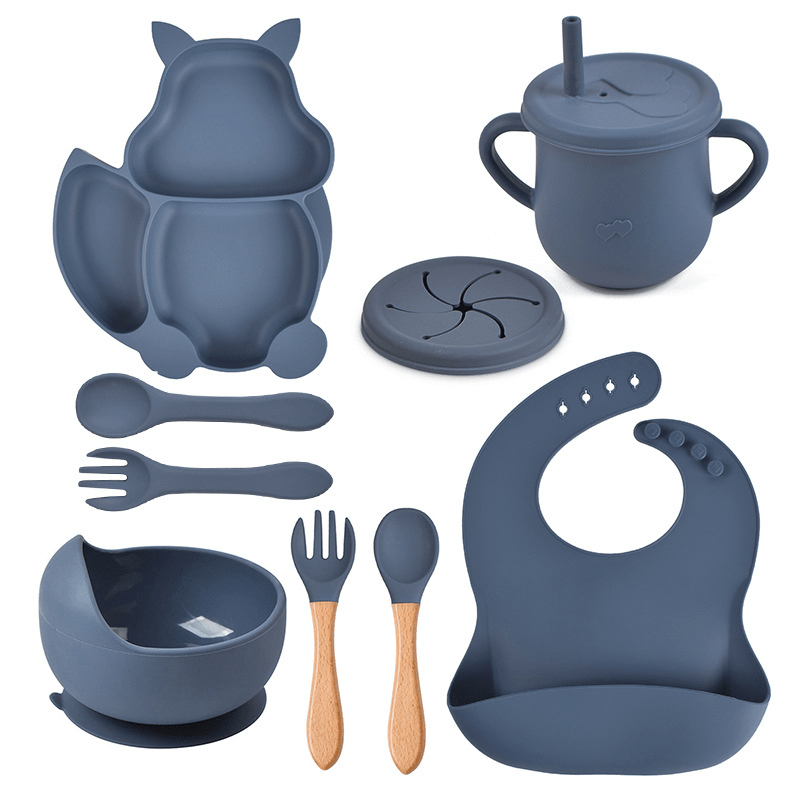 Collection of blue baby utensils and accessories on a white background