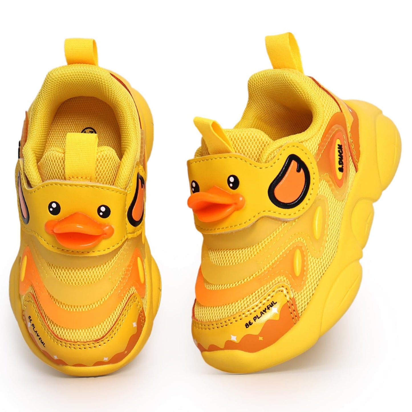 Yellow children's shoes with duck design on a white background