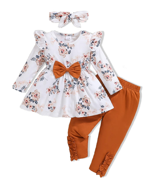 Children's outfit with floral top and orange pants on a white background