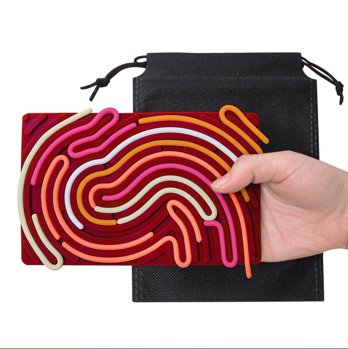 Colorful hair tie set with a black drawstring bag on a white background