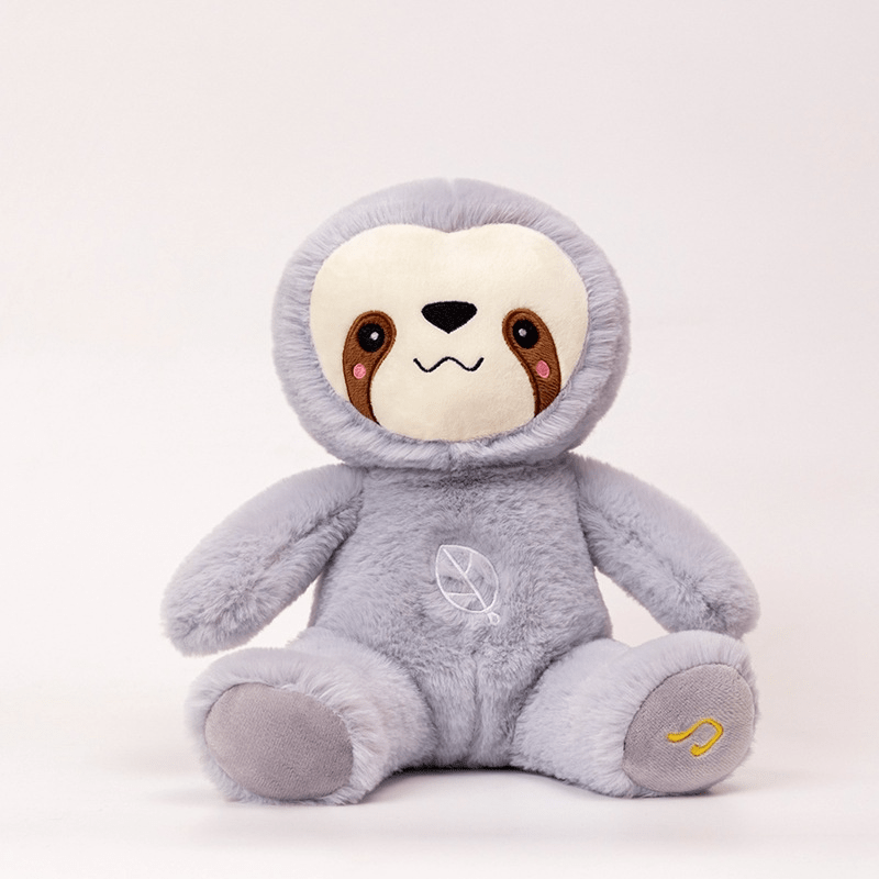 Plush toy sloth in a gray hoodie on a white background