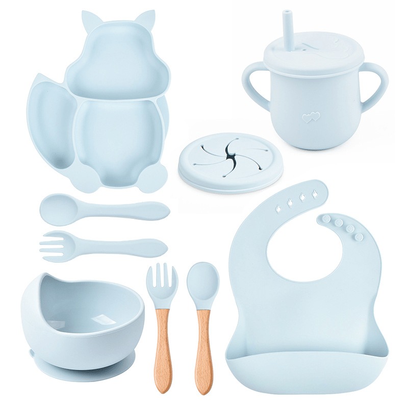 Collection of baby feeding utensils and accessories in light blue on a white background