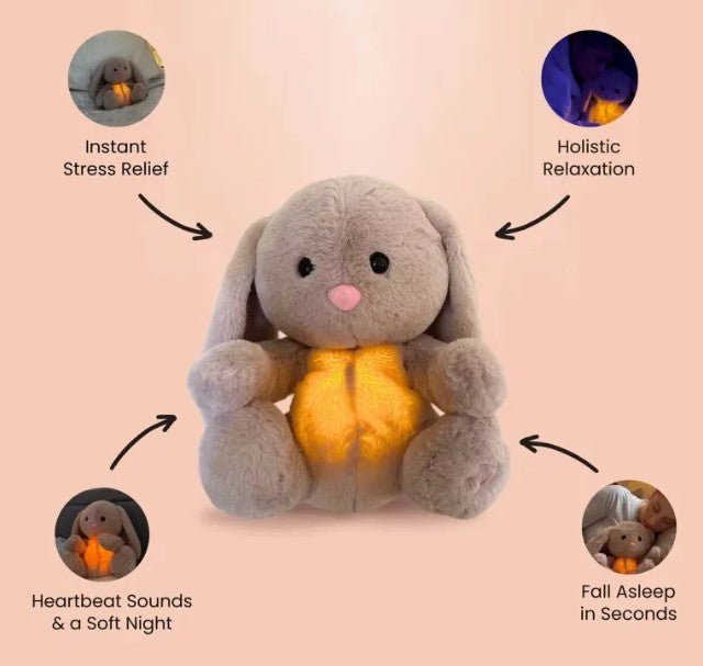 Gray plush bunny with glowing belly on a pink background, labeled for stress relief, relaxation, heartbeats, and sleep aid.