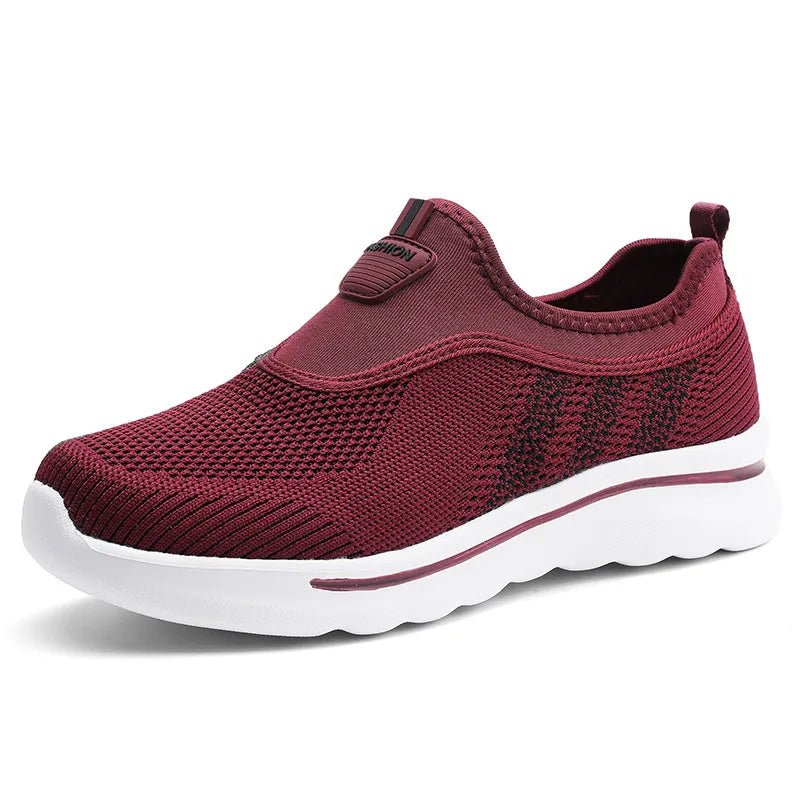 Maroon slip-on sneaker with white sole on a white background