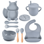 Collection of gray baby feeding utensils and accessories on a white background