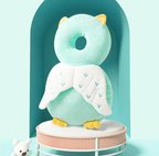 Plush owl toy with a donut-shaped head on a stand against a light blue background