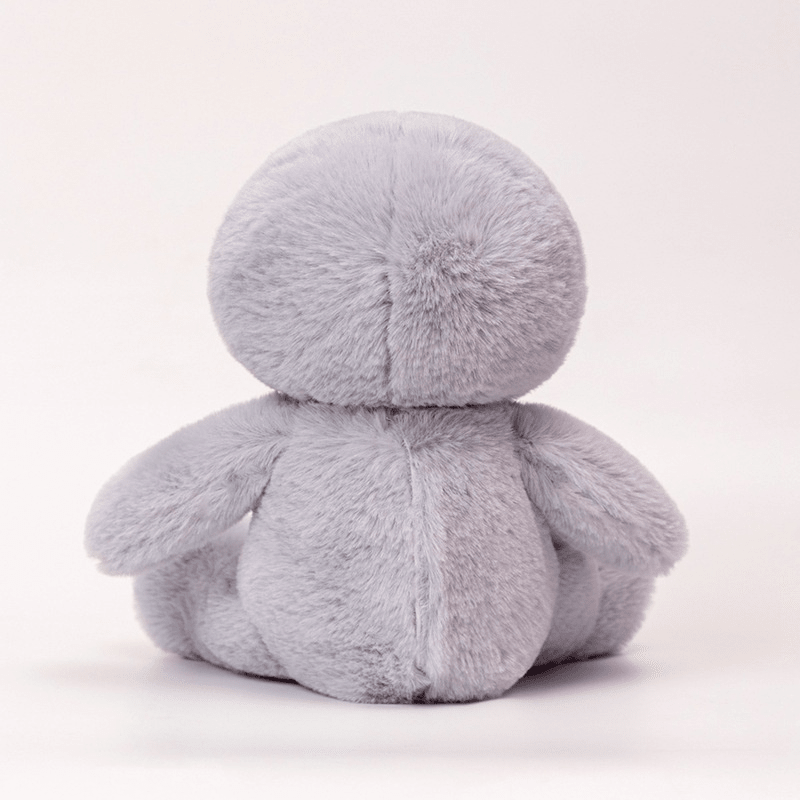 Plush toy with a round body and head on a white background