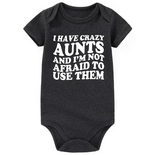 Black baby onesie with white text on a white background